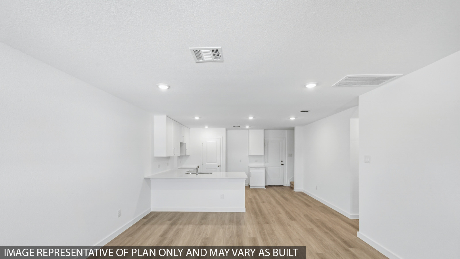 Open concept living, dining, and kitchen area