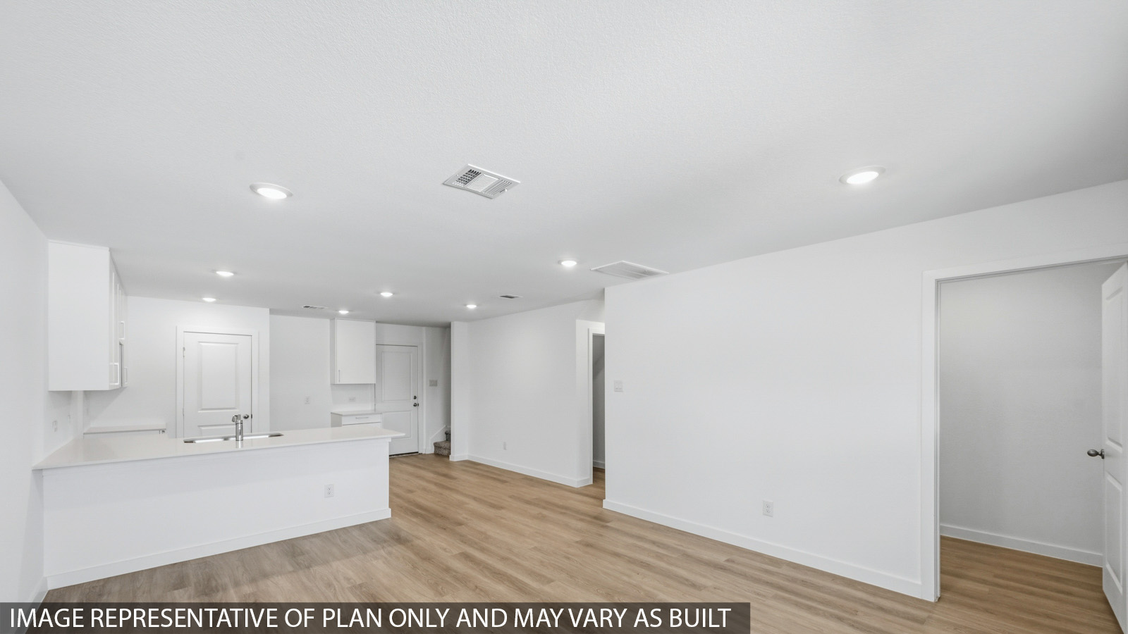 Open concept living, dining, and kitchen area
