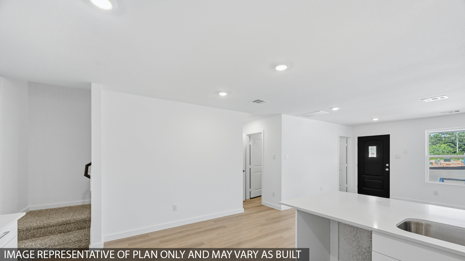 Open concept living, dining, and kitchen area