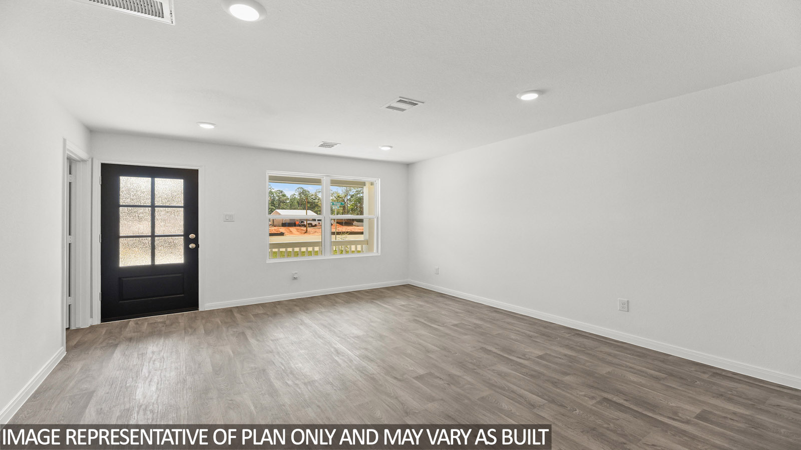 Open concept living, dining, and kitchen area