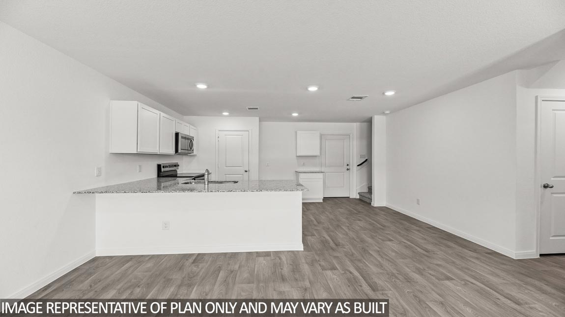 Open concept living, dining, and kitchen area