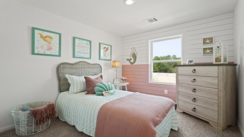Secondary bedroom with carpet flooring
