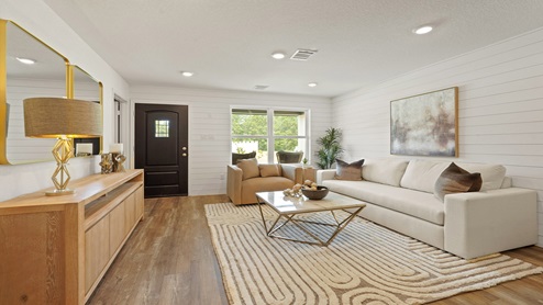 Spacious living area with vinyl flooring