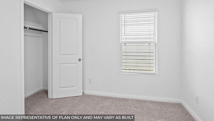Primary bedroom with carpet flooring