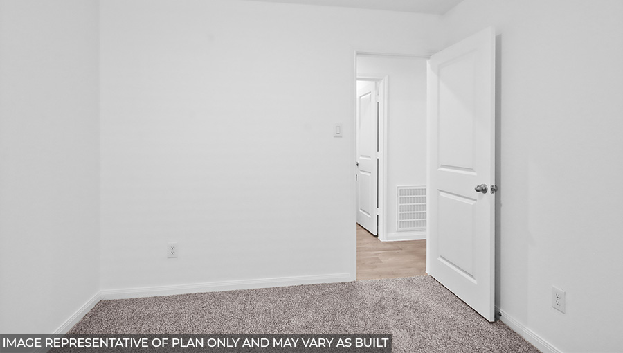 Primary bedroom with carpet flooring