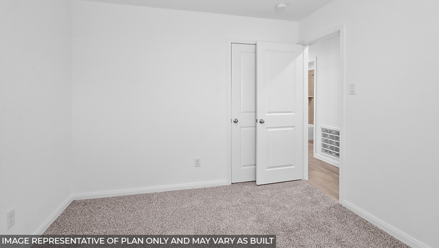 Primary bedroom with carpet flooring