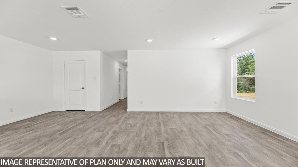 Open concept living, dining, and kitchen area
