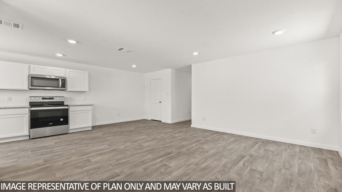 Open concept living, dining, and kitchen area