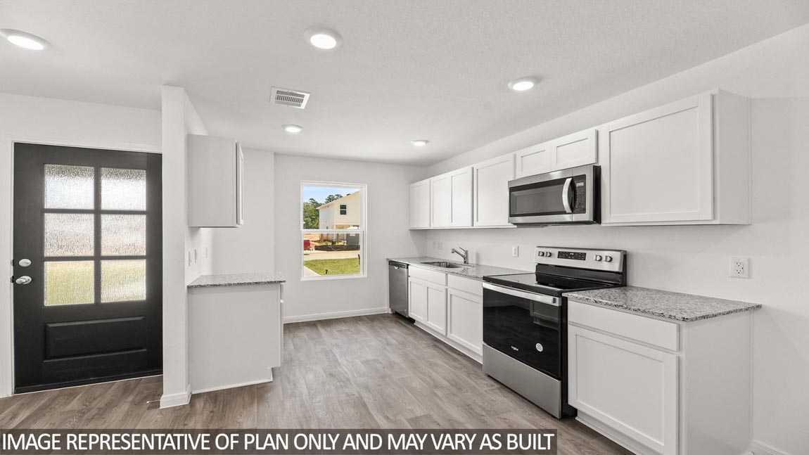 Open concept living, dining, and kitchen area