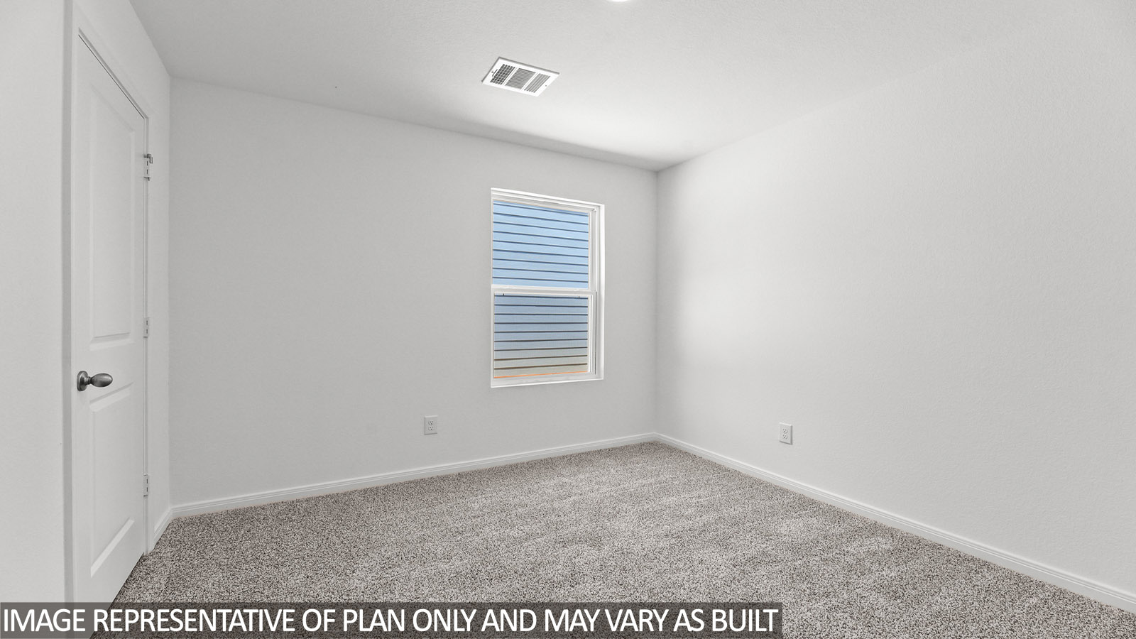 Primary bedroom with carpet flooring