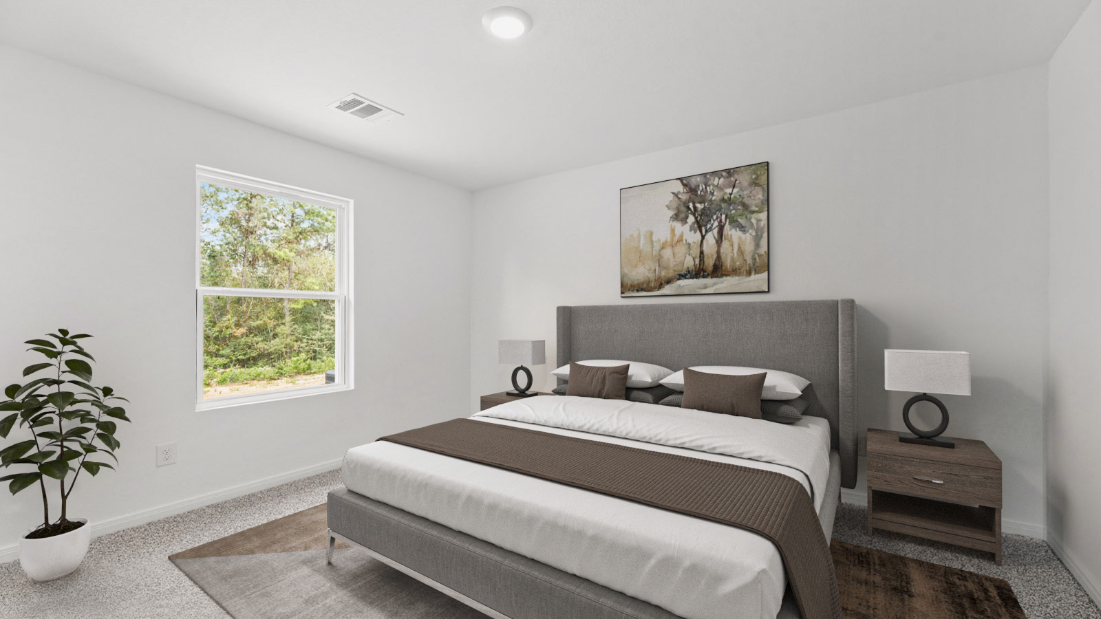 Staged primary bedroom with carpet flooring and a bright window.