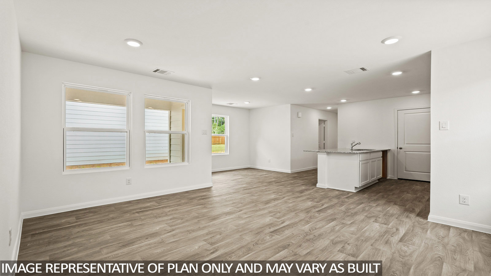 Open concept living, dining, and kitchen area