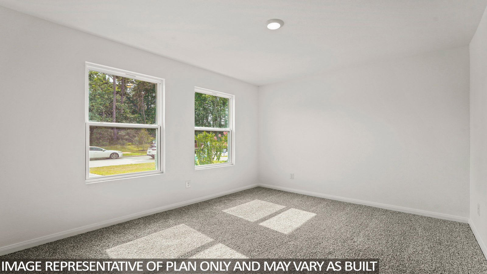 Primary bedroom with bright windows