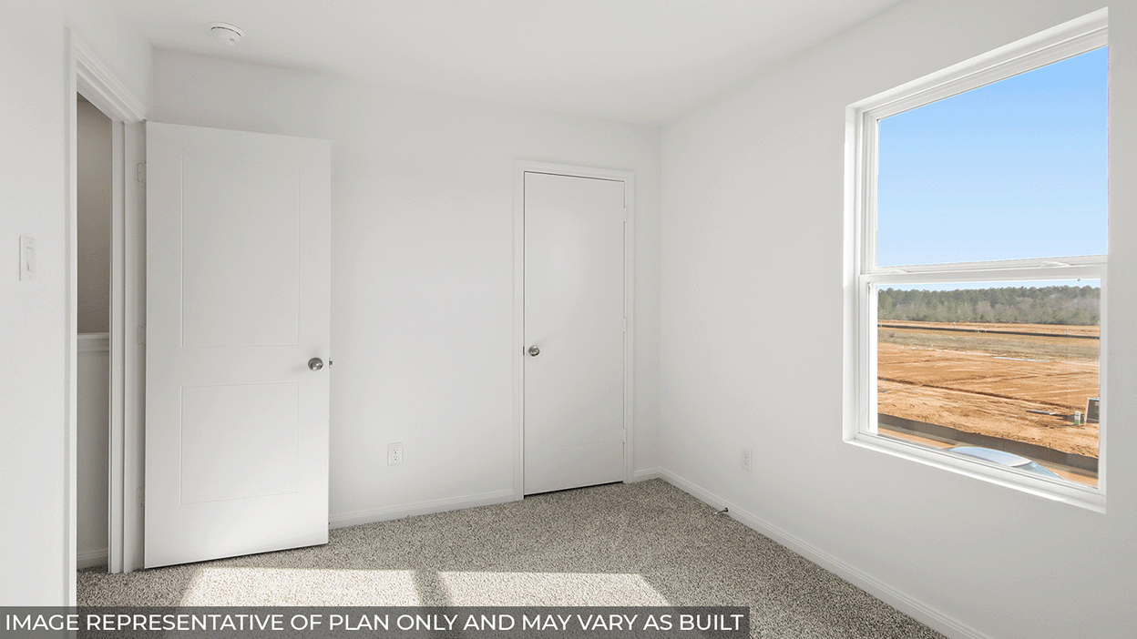 Secondary bedroom with bright window