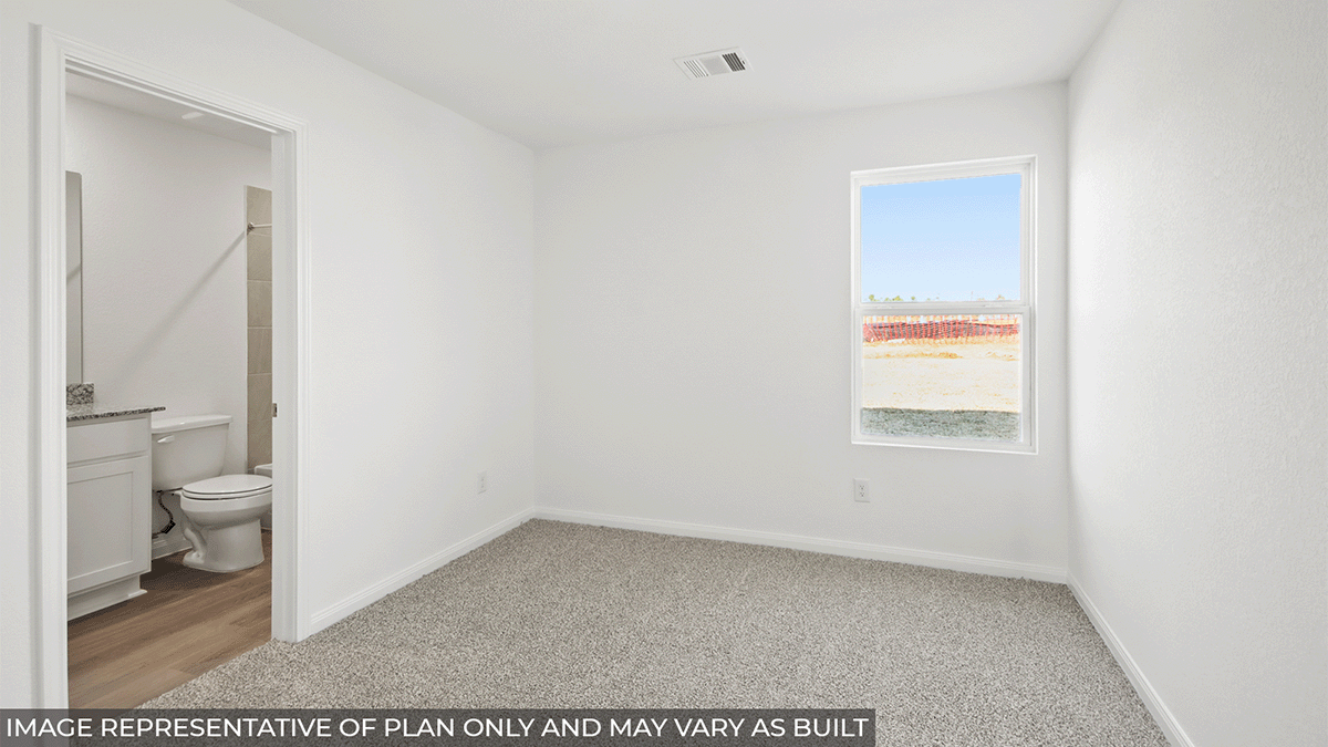 Primary bedroom with carpet flooring