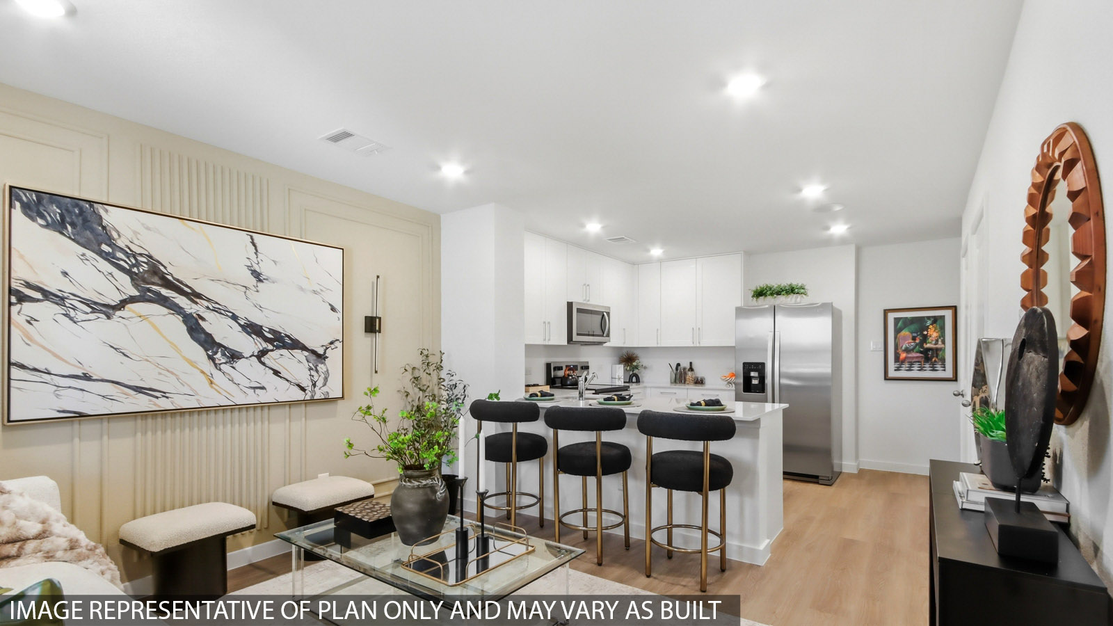Spacious living area with vinyl flooring