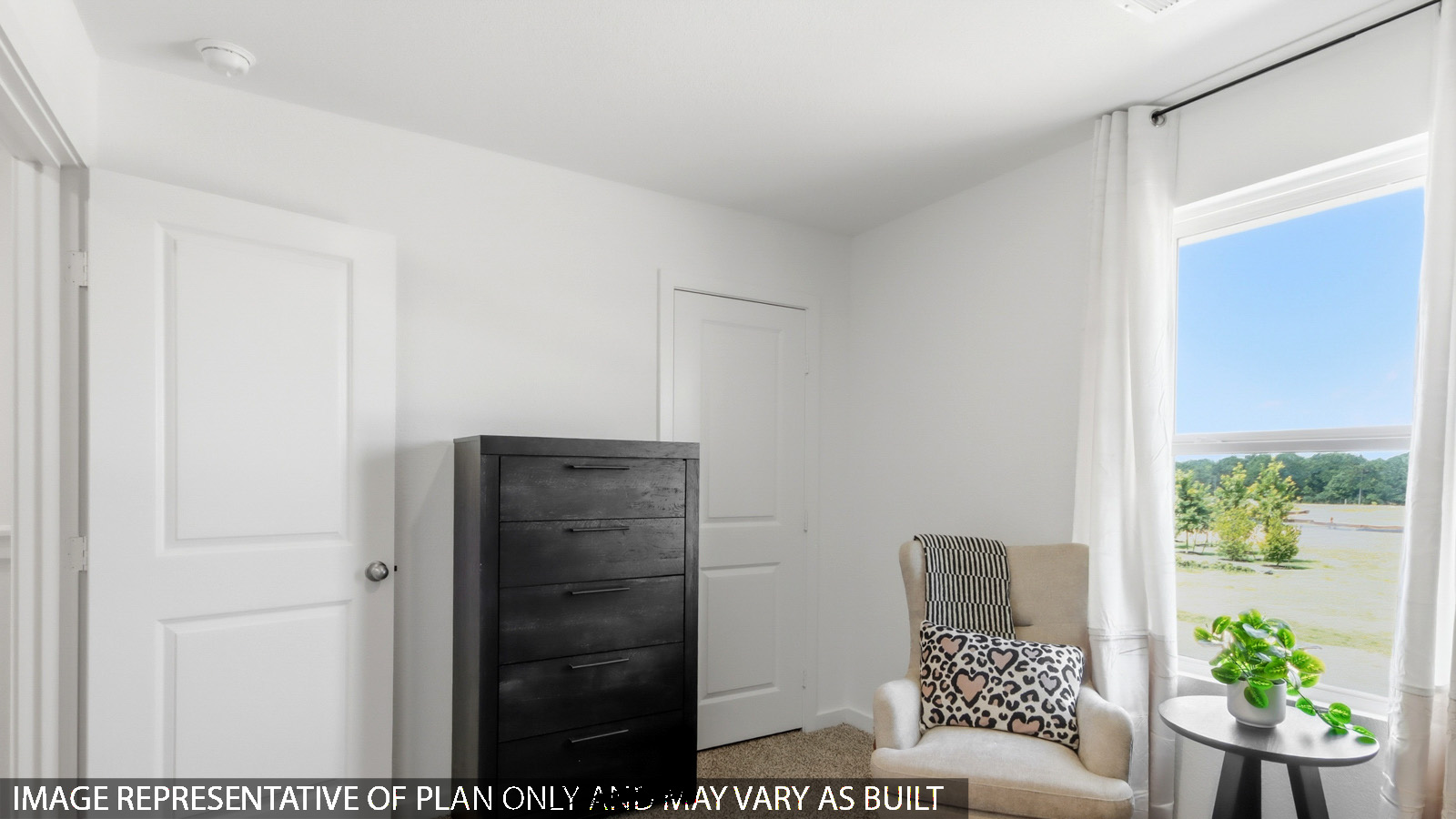 secondary bedroom with carpet flooring