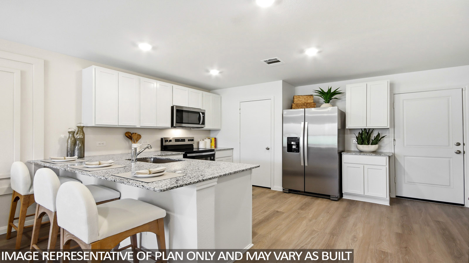 Spacious living area with vinyl flooring