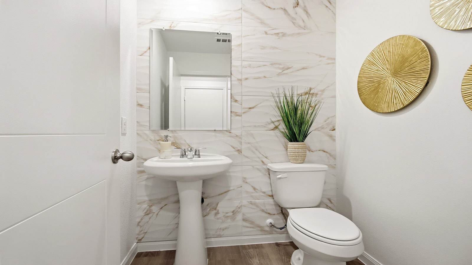 Powder bathroom with pedestal sink