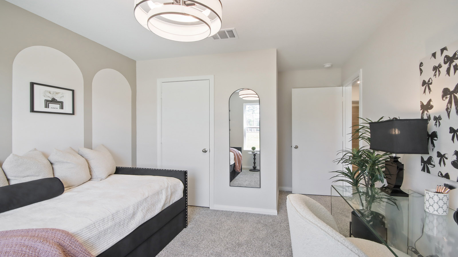 Secondary bedroom with carpet flooring