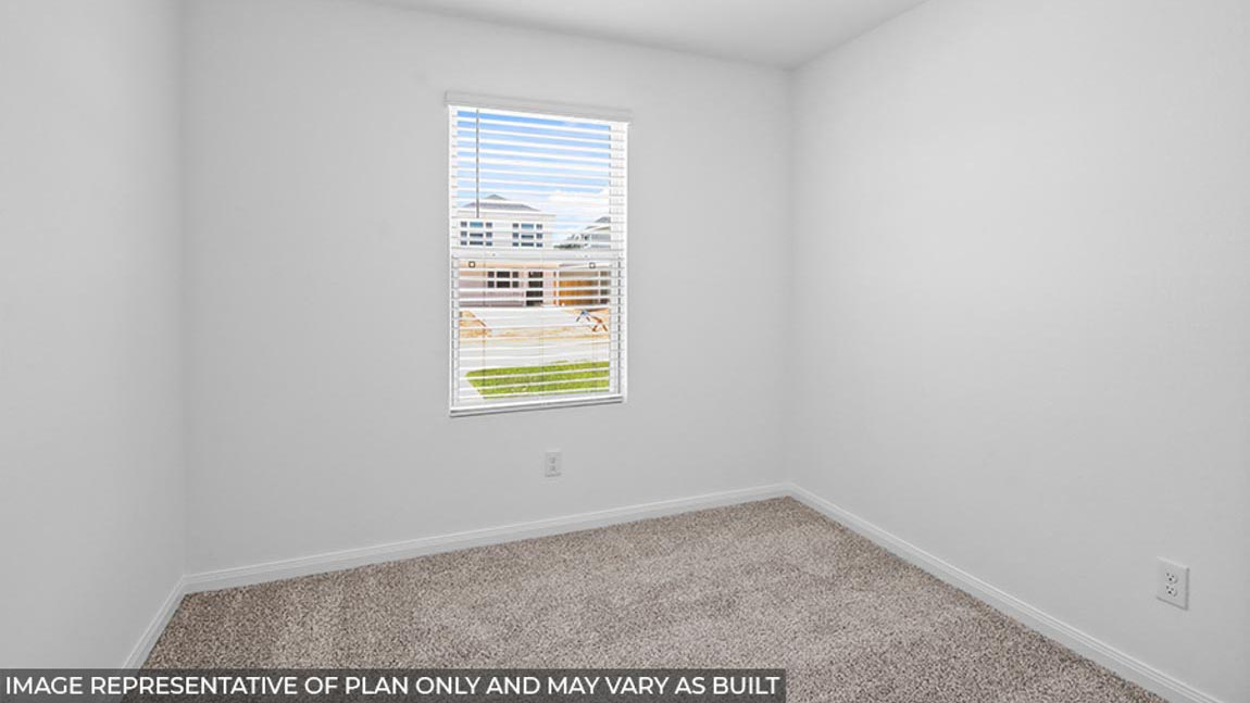 Primary bedroom with carpet flooring