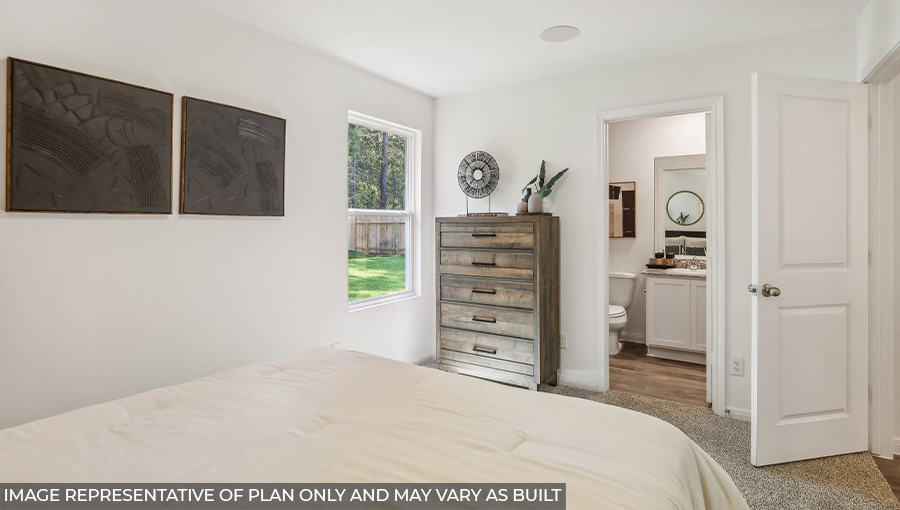 Primary bedroom with bright windows