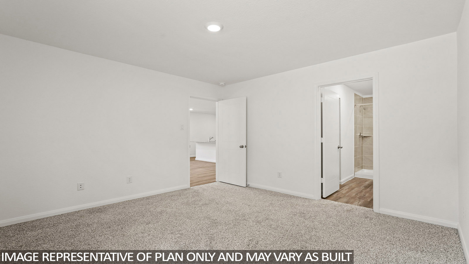 Primary bedroom with bright windows