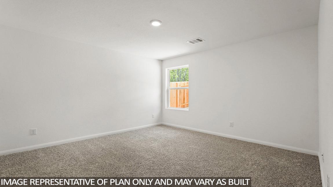 Primary bedroom with carpet flooring
