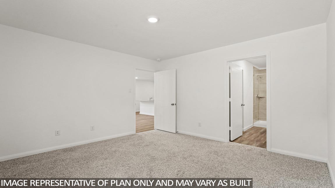 Primary bedroom with carpet flooring