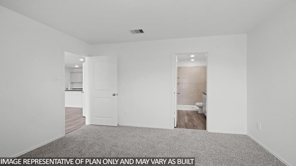 Primary bedroom with carpet flooring