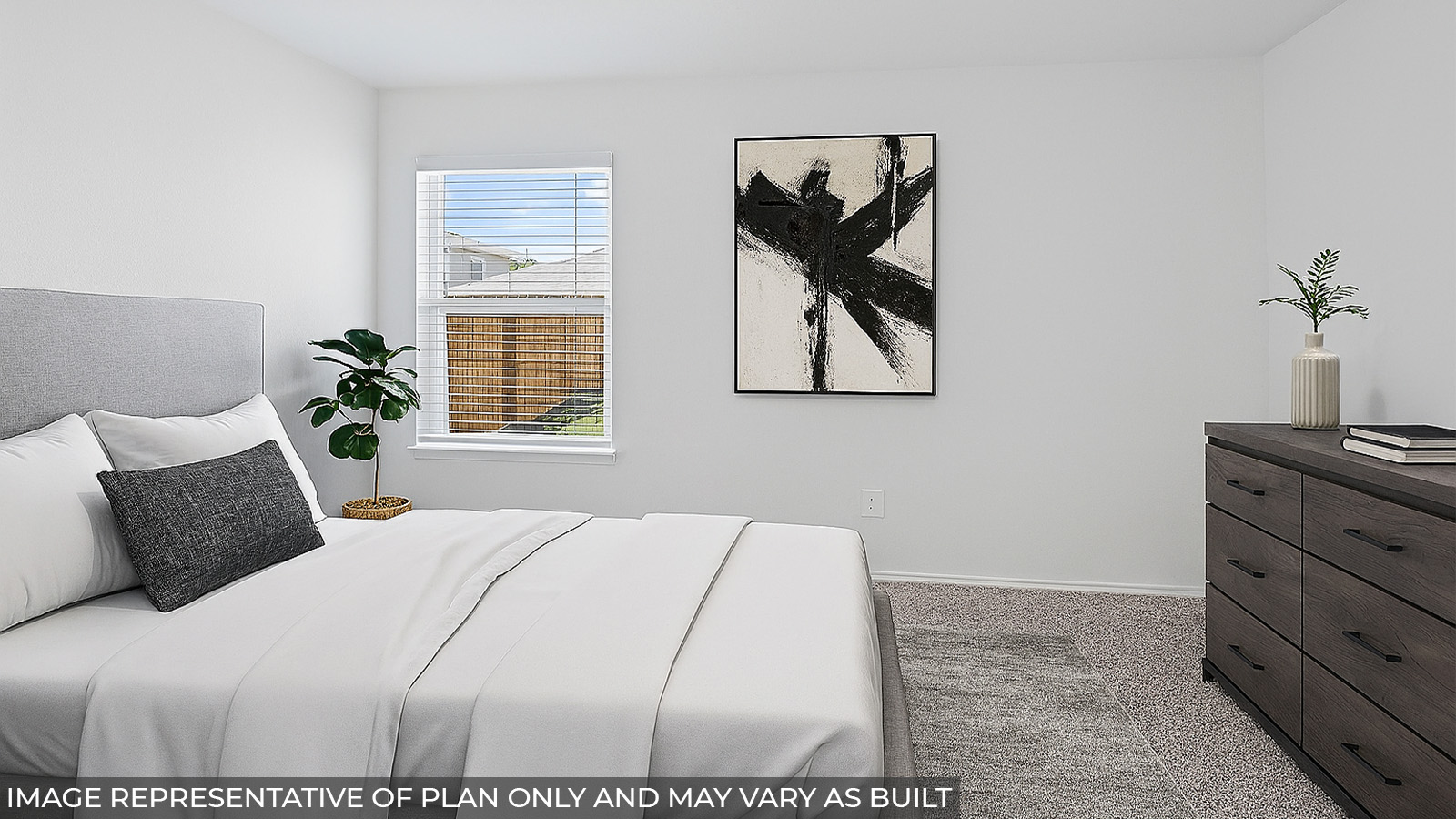 Staged primary bedroom with carpet flooring and a bright window.
