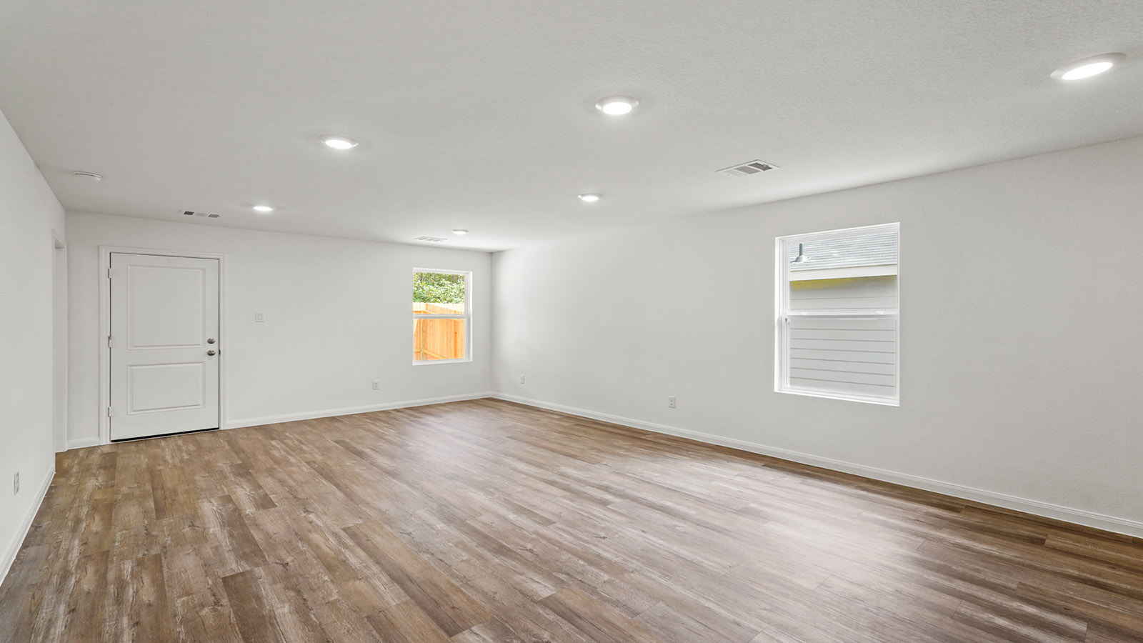 Open concept living, dining, and kitchen area