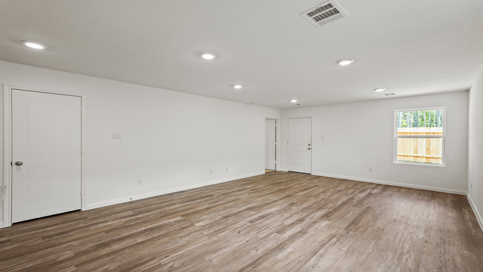 Open concept living, dining, and kitchen area