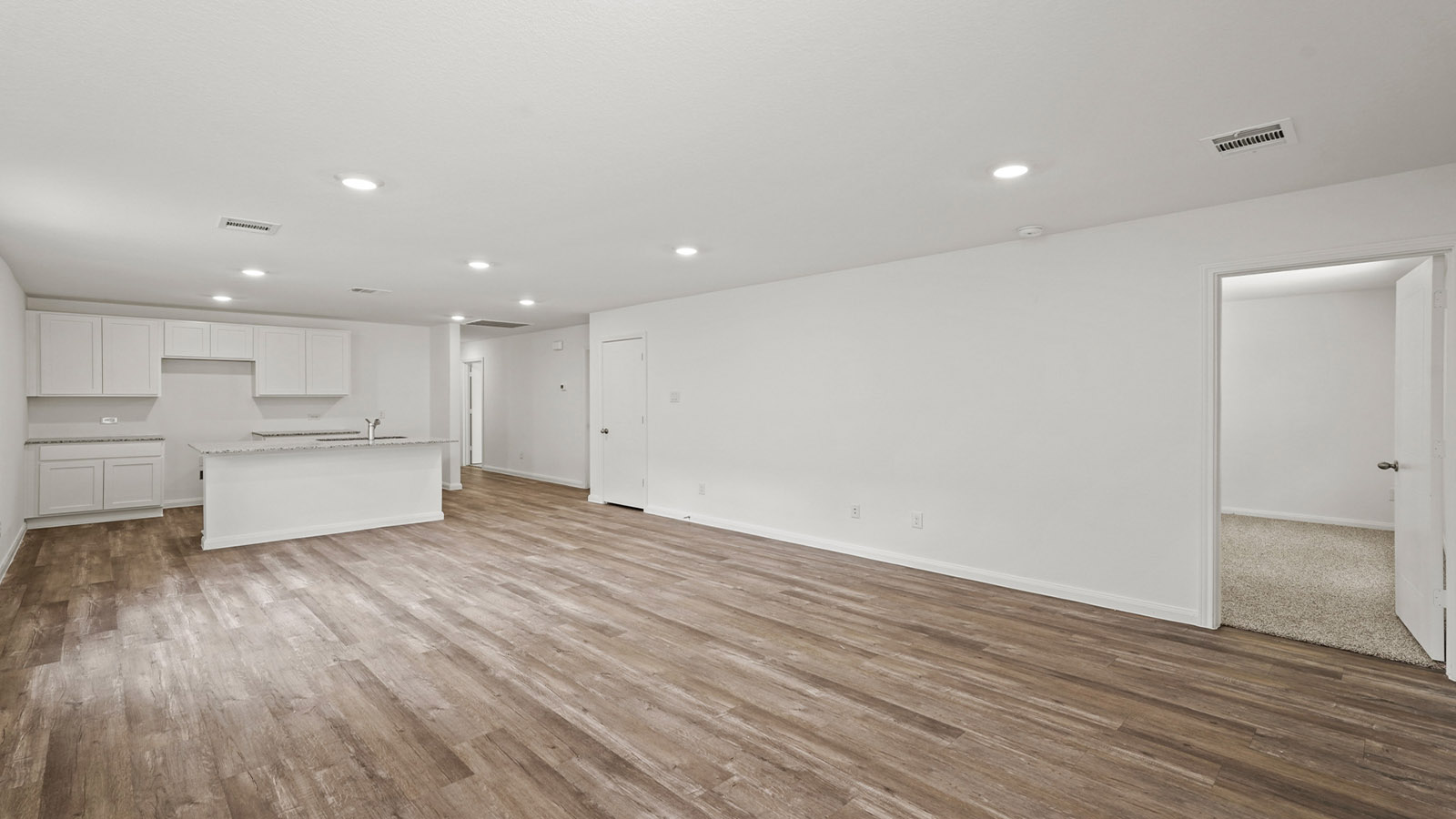 Open concept living, dining, and kitchen area