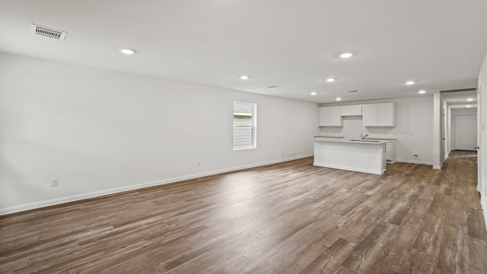 Open concept living, dining, and kitchen area