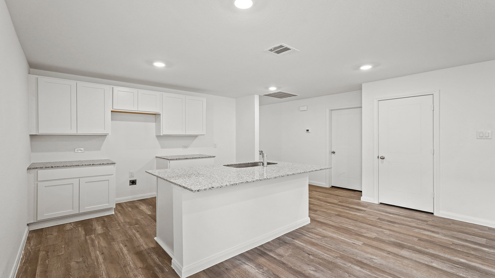 Open concept living, dining, and kitchen area