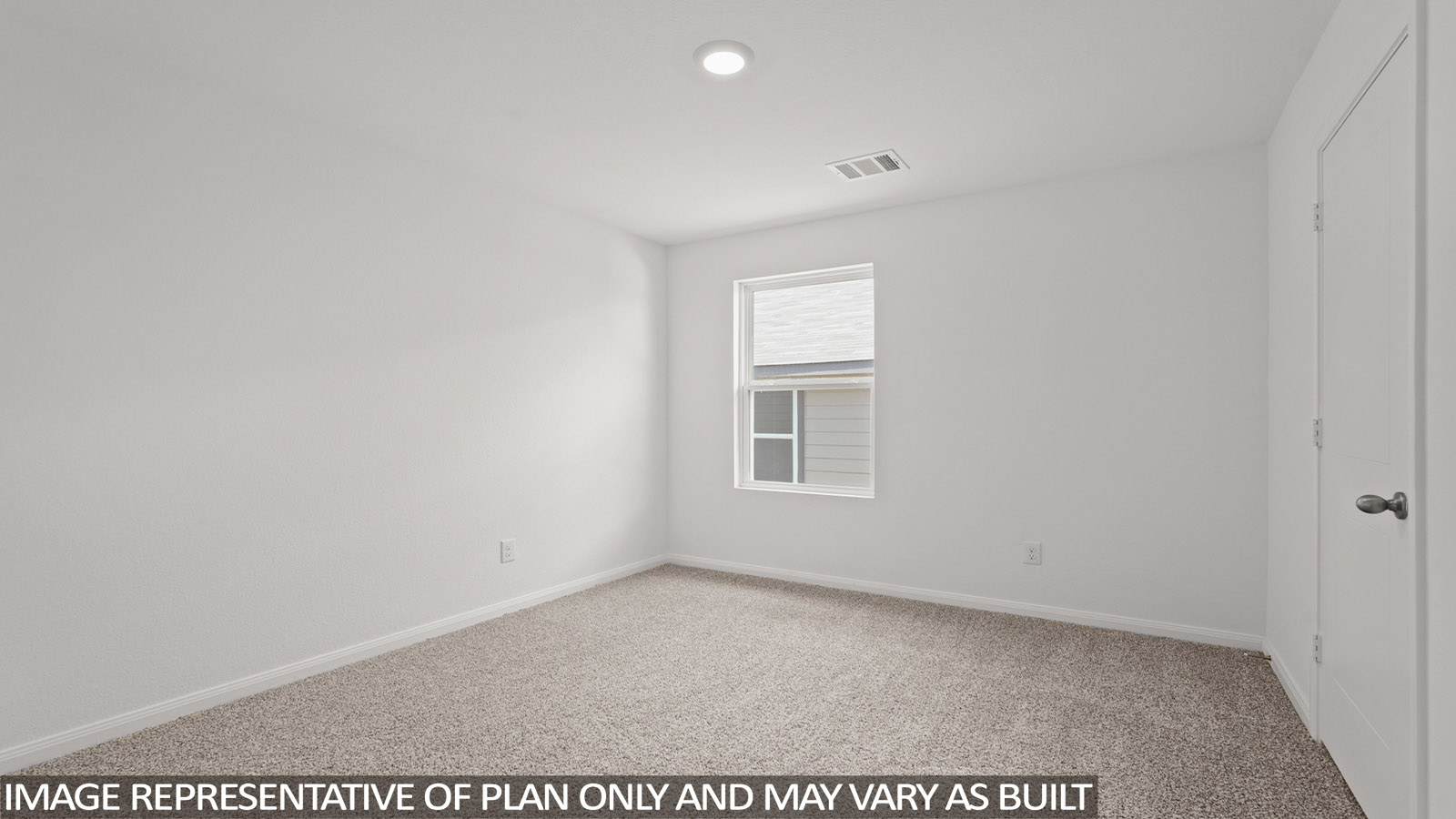 Secondary bedroom with carpet flooring