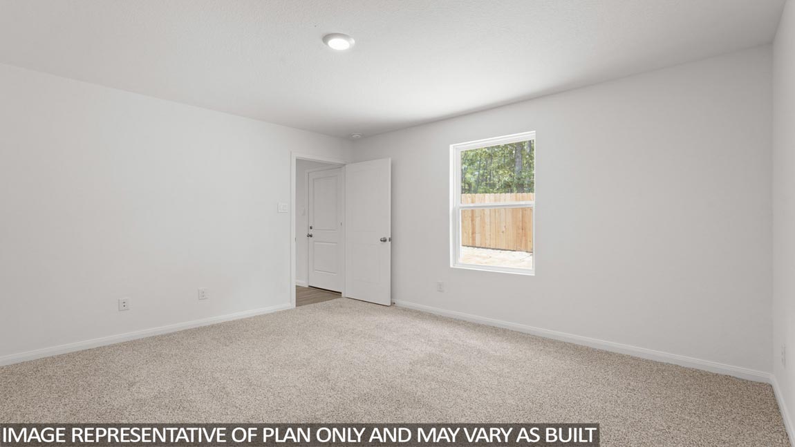 Primary bedroom with bright windows