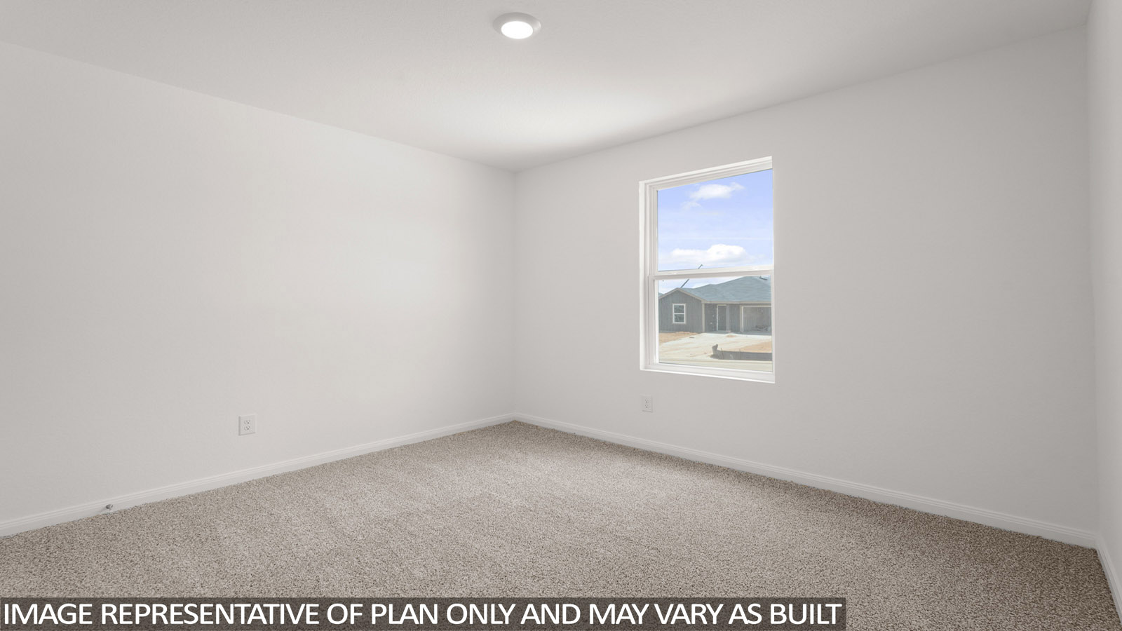 Secondary bedroom with carpet flooring