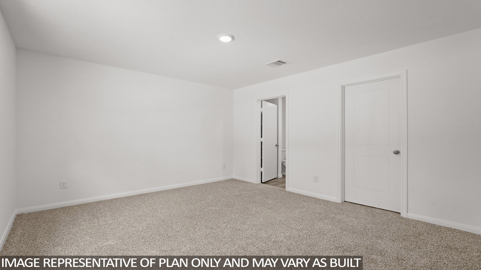 Primary bedroom with carpet flooring