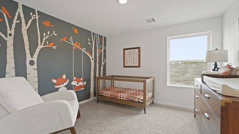 Secondary bedroom with carpet flooring