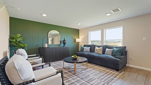 Spacious living area with vinyl flooring