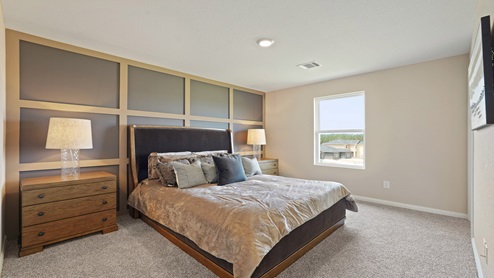 Primary bedroom with carpet flooring