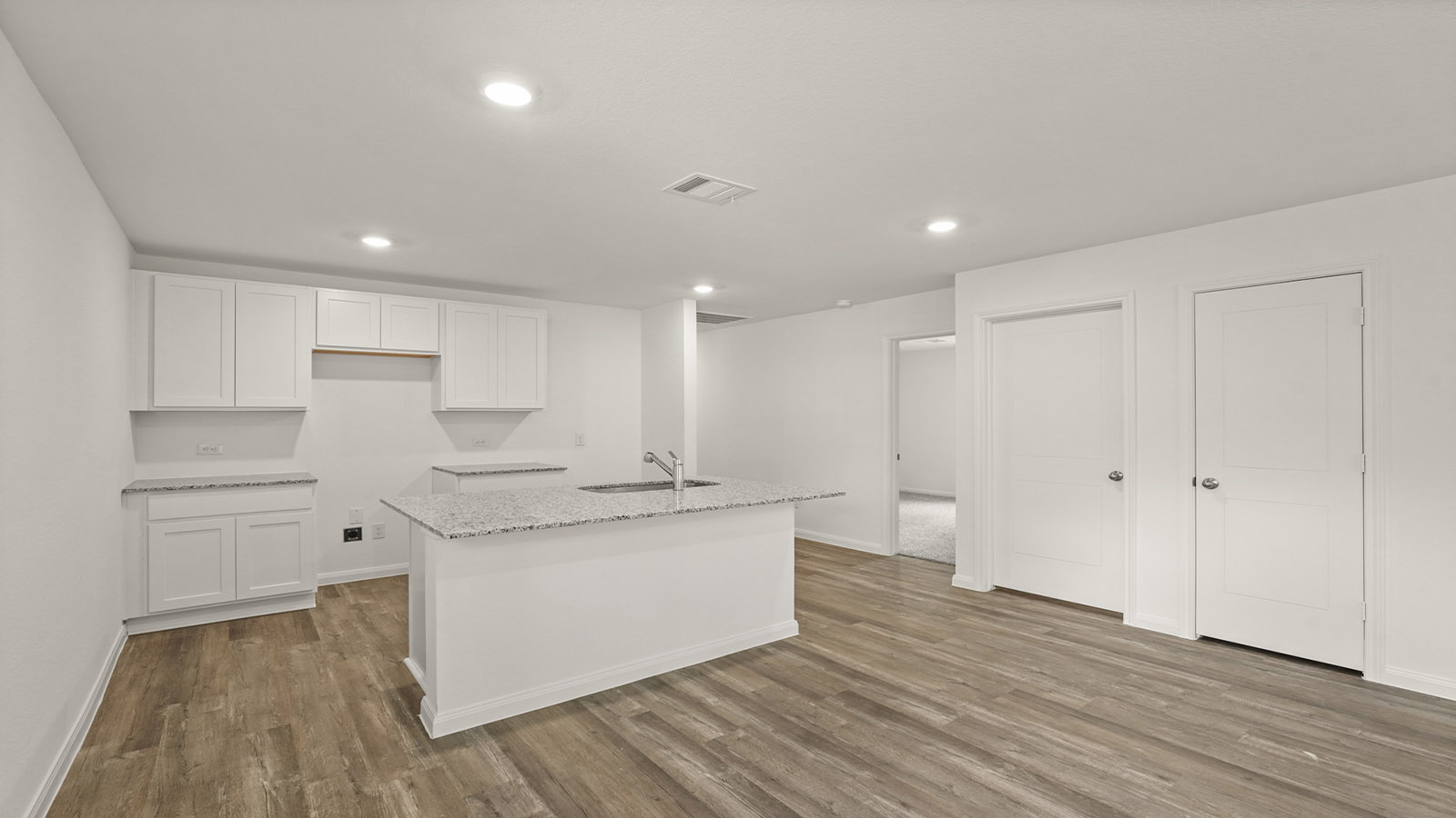 Open concept living, dining, and kitchen area