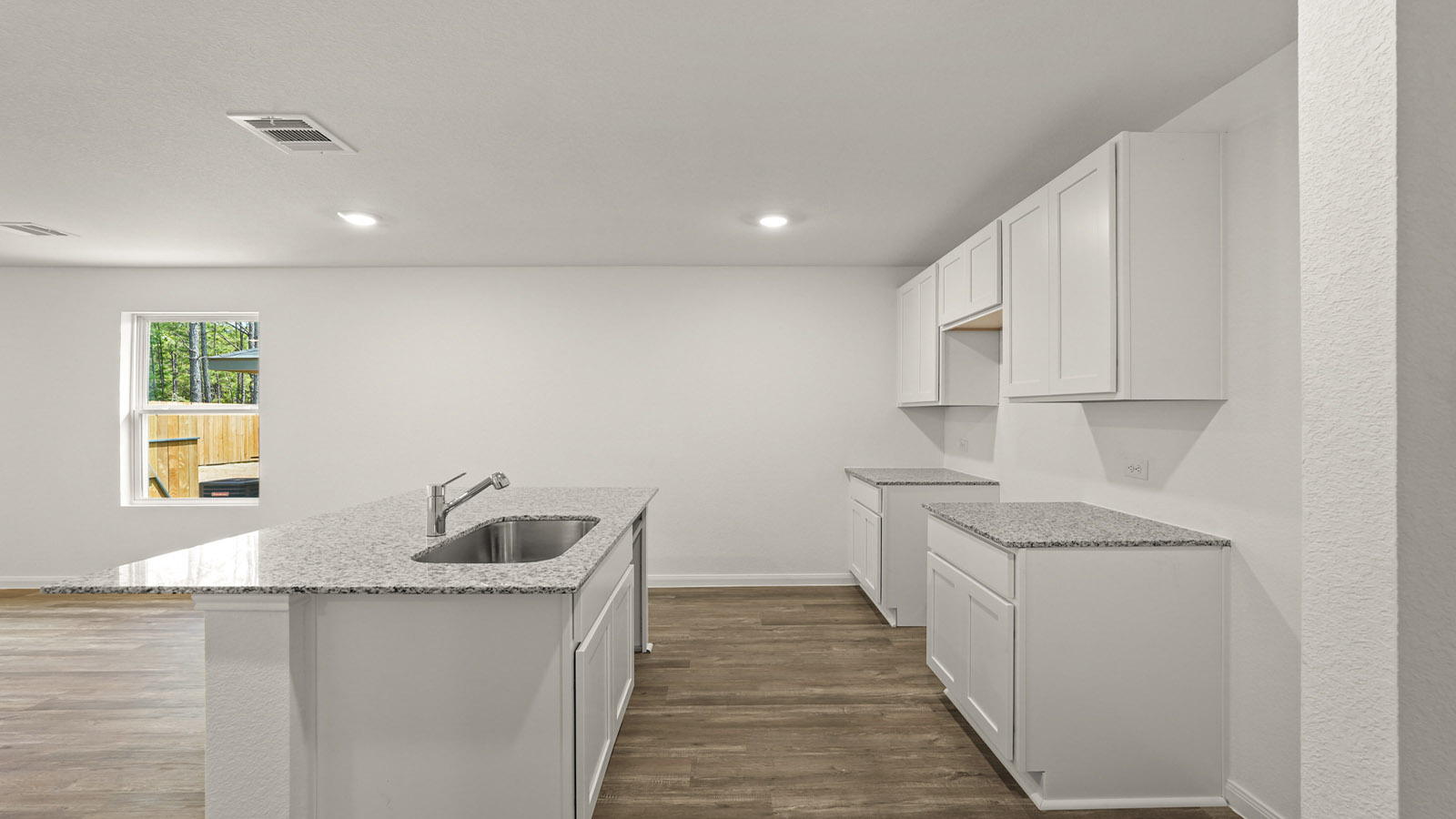 Open concept living, dining, and kitchen area