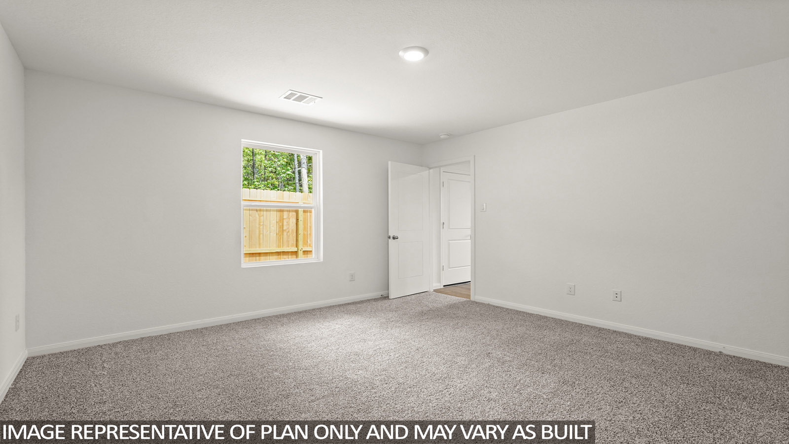 Primary bedroom with bright windows