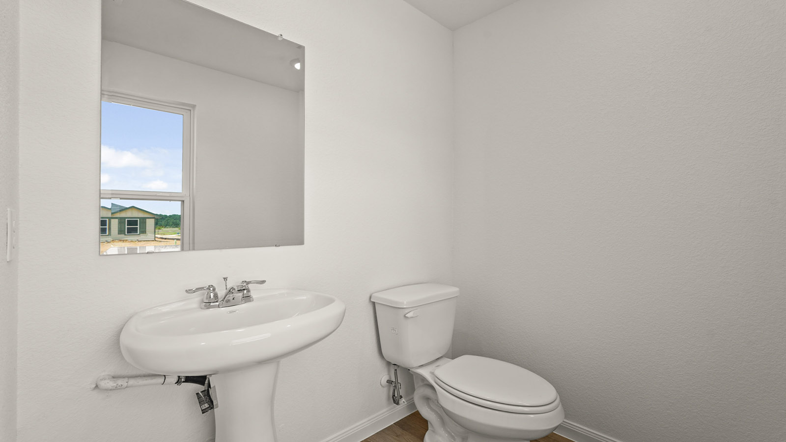 Powder bathroom with pedestal sink