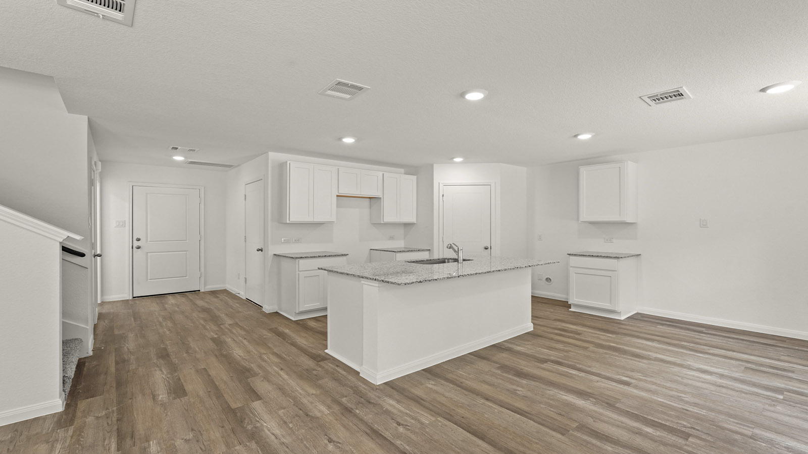 Open concept living, dining, and kitchen area