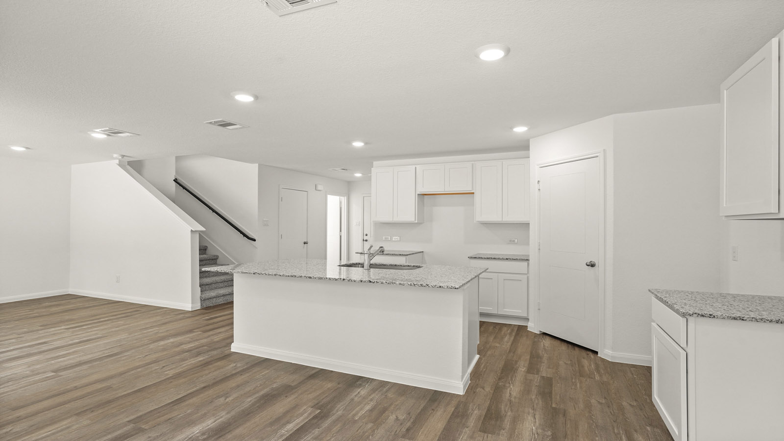 Open concept living, dining, and kitchen area