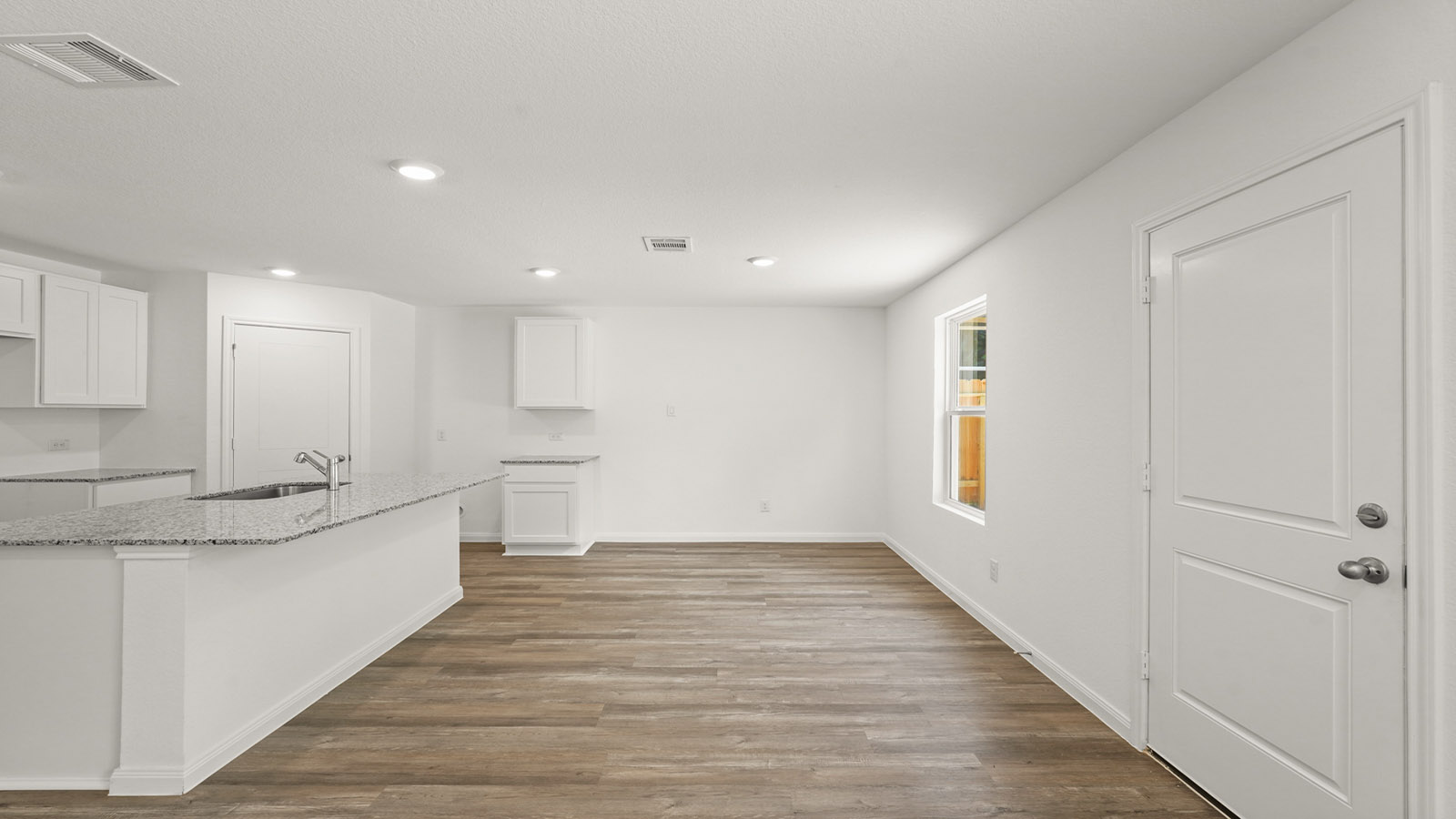 Open concept living, dining, and kitchen area